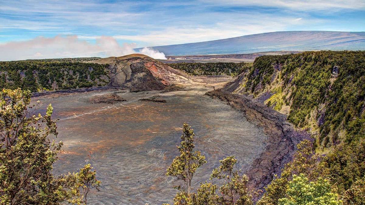 Aerial view of the Kīlauea Iki Crater with trees and skyline on the Big Island, Hawaii, USA